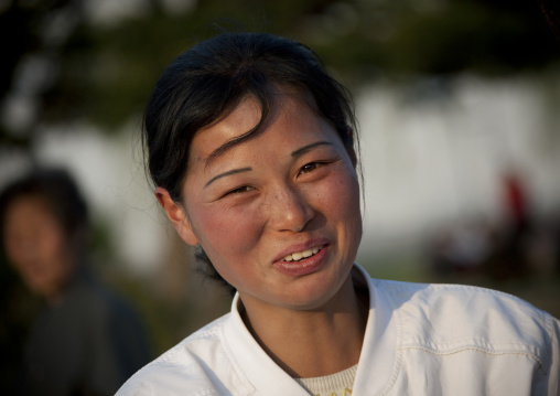 Portrait of a smiling North Korean woman in the street, Kangwon Province, Wonsan, North Korea