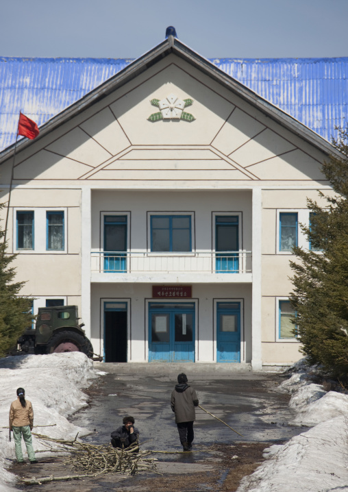 North Korean people cleaning the road leading to a building, Ryanggang Province, Samjiyon, North Korea