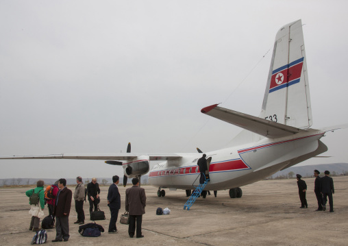 Tourists in front of an air Koryo North Korean plane for a domestic flight, Ryanggang Province, Samjiyon, North Korea