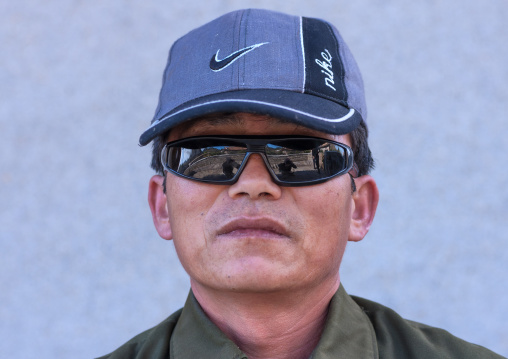 North Korean man wearing a Nike cap and sunglasses, North Hamgyong Province, Jung Pyong Ri, North Korea