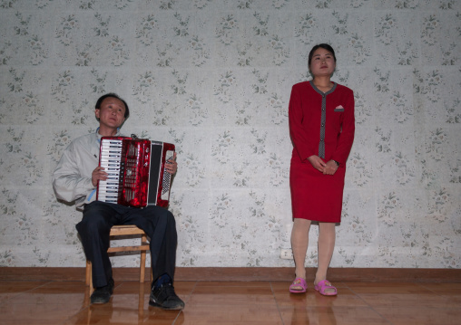 North Korean people singing inside a house, North Hamgyong Province, Jung Pyong Ri, North Korea