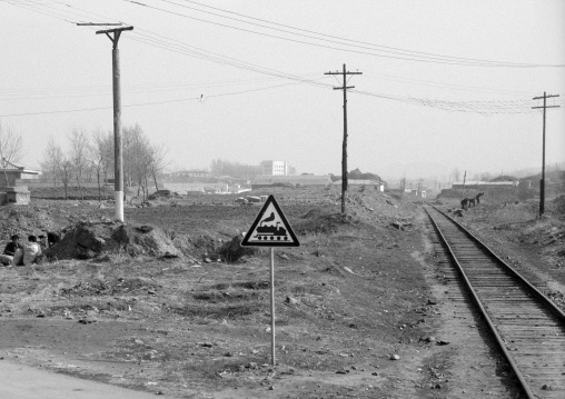 Railway warning sign in front of a railway, South Pyongan Province, Nampo, North Korea