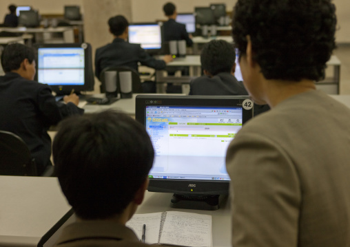 Young men using intranet on a computer in the Grand people's study house, Pyongan Province, Pyongyang, North Korea