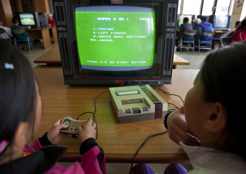 North Korean children playing video games in Songdowon international children's camp, Kangwon Province, Wonsan, North Korea