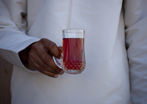 Man Holding A Cup Of Tea During Tea Time, Taqa, Oman