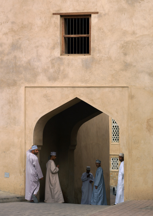 Muslim Men Gathering Under The Door In Arabic Style, Nizwa, Oman