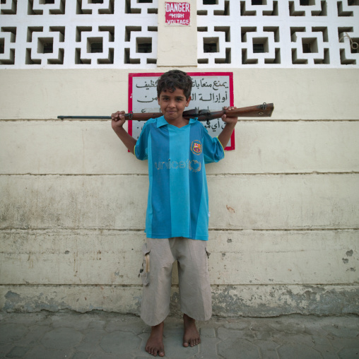 Boy With A Gun On His Shoulders, Salalah, Oman
