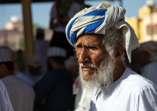 Old omani man in the cattle market, Ad Dakhiliyah Region, Nizwa, Oman