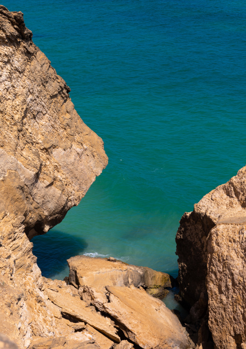 Cliff over the green water, Dhofar Governorate, Taqah, Oman
