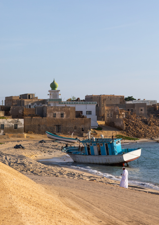 Fishing boat in front of the mosque in the old town, Dhofar Governorate, Mirbat, Oman