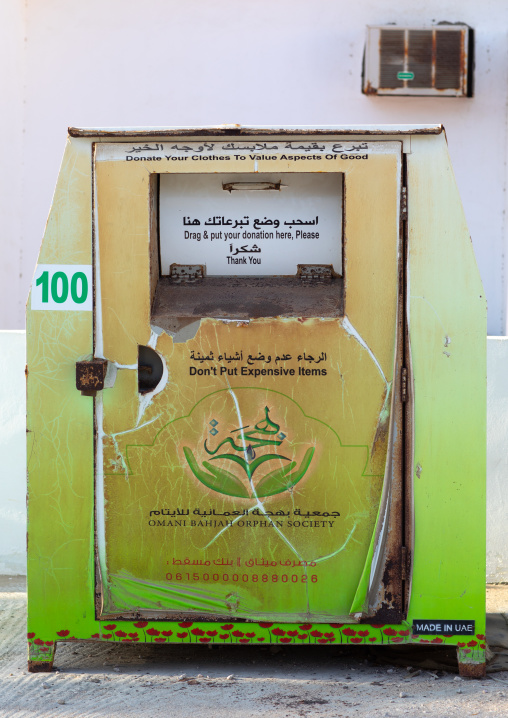 Box in the street to collect clothes for poor people, Dhofar Governorate, Mirbat, Oman