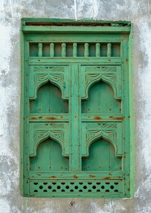 Wooden carved window of an abandoned house, Dhofar Governorate, Mirbat, Oman