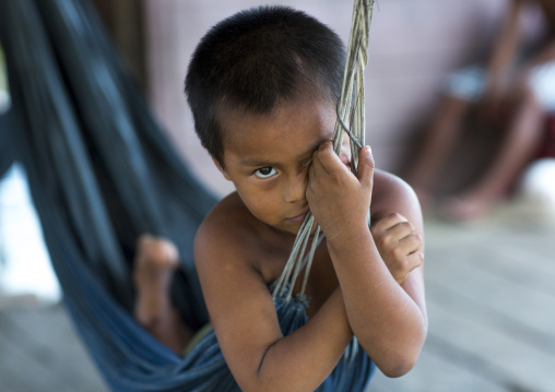 Panama, Darien Province, Puerta Lara, Wounaan Tribe Boy In A Hammock
