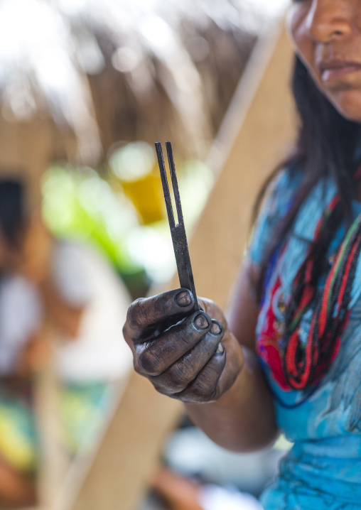 Panama, Darien Province, Bajo Chiquito, Woman Of The Native Indian Embera Showing A Stick For Jagua Bodypaint