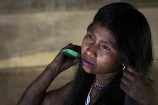 Panama, Darien Province, Bajo Chiquito, Woman Of The Native Indian Embera Tribe Combing Hair