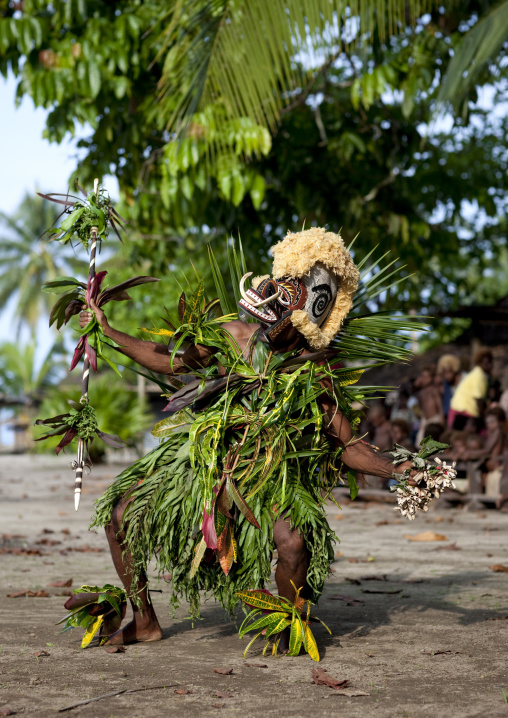 Malagan tatuana masks dance during a funeral ceremony, New Ireland Province, Langania, Papua New Guinea