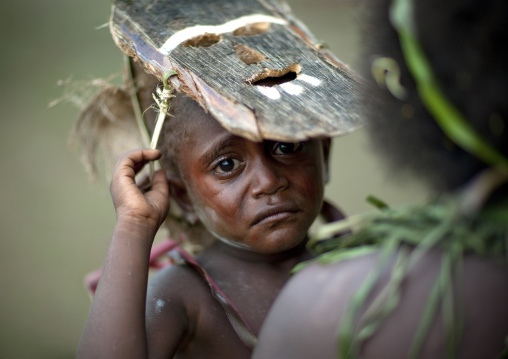 Portrait of a boy crying during Malagan tatuana masks dance, New Ireland Province, Langania, Papua New Guinea