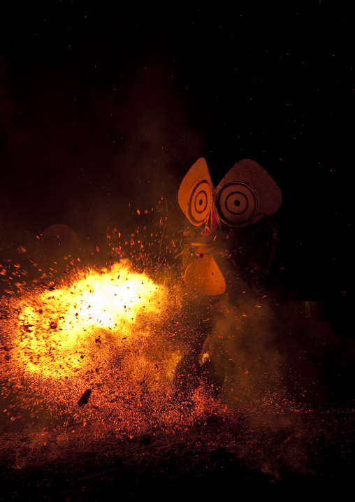 Dancer with a giant mask during a Baining tribe fire dance, East New Britain Province, Rabaul, Papua New Guinea