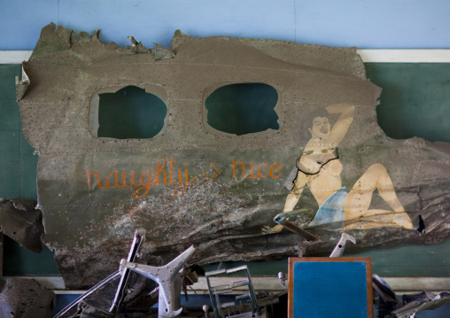 Pin up painted on an old plane wrecks in the war museum garden, East New Britain Province, Rabaul, Papua New Guinea