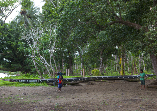 Giant canoe under the trees, Milne Bay Province, Alotau, Papua New Guinea
