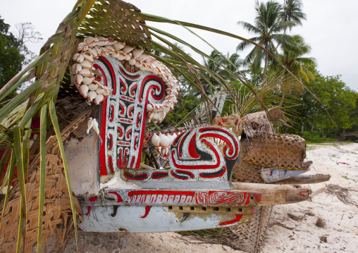 Traditional canoe with carved and painted decorations, Milne Bay Province, Trobriand Island, Papua New Guinea