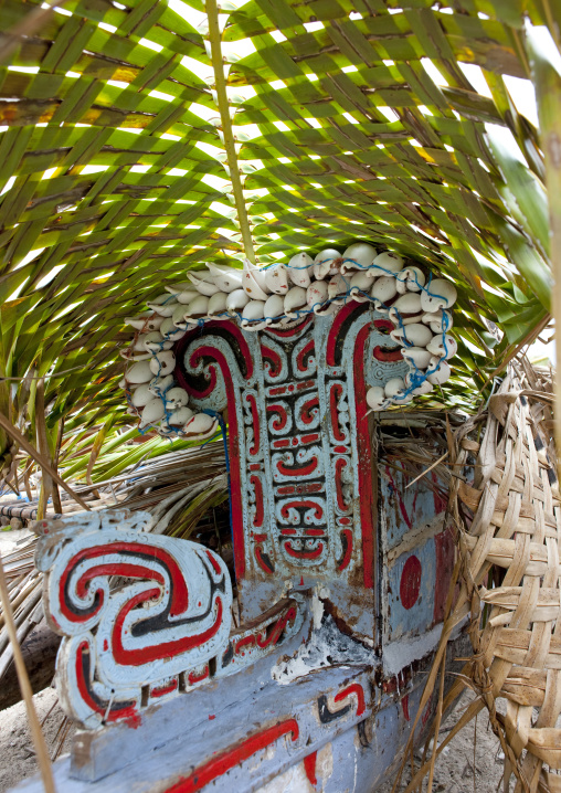 Traditional canoe with carved and painted decorations, Milne Bay Province, Trobriand Island, Papua New Guinea