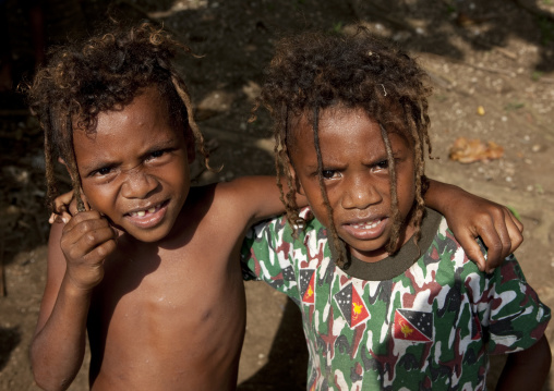 Portrait of twin boys with dreadlocks, Milne Bay Province, Trobriand Island, Papua New Guinea