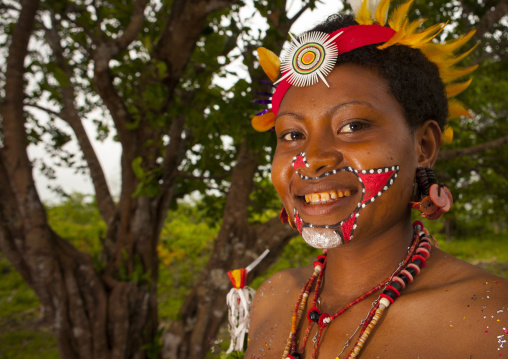 Portrait of a smiling tribal woman in traditional clothing, Milne Bay Province, Trobriand Island, Papua New Guinea