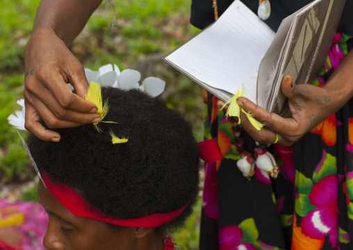 Tribal woman makeup before a ceremony, Milne Bay Province, Trobriand Island, Papua New Guinea