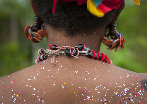 Tribal woman with poillen on her back, Milne Bay Province, Trobriand Island, Papua New Guinea