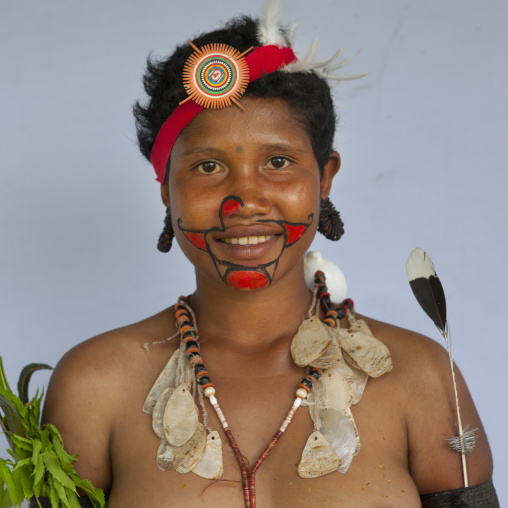 Portrait of a smiling tribal woman in traditional clothing, Milne Bay Province, Trobriand Island, Papua New Guinea