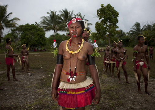 Tribal dancers in traditional clothing during a sing-sing, Milne Bay Province, Trobriand Island, Papua New Guinea