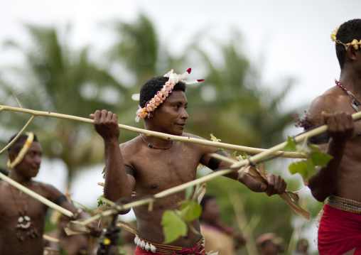 Tribal dancers in traditional clothing during a ceremony, Milne Bay Province, Trobriand Island, Papua New Guinea
