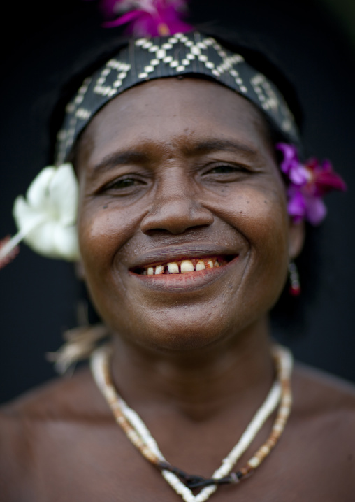 Smiling woman wearing flowers in the hair, Autonomous Region of Bougainville, Bougainville, Papua New Guinea