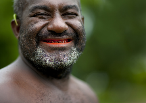 Portrait of a man with a betel red smile, Autonomous Region of Bougainville, Bougainville, Papua New Guinea