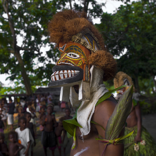 Malagan tatuana masks dance during a funeral ceremony, New Ireland Province, Langania, Papua New Guinea