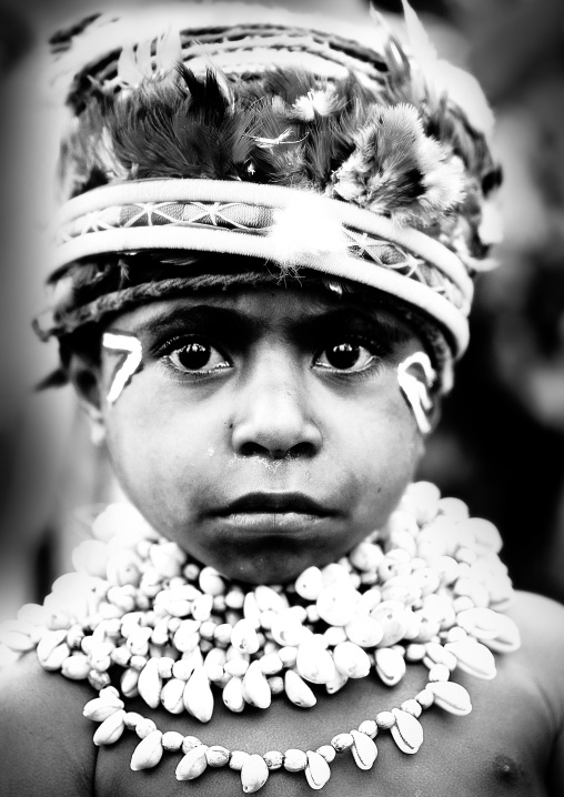 Highlander boy with traditional makeup during a sing-sing, Western Highlands Province, Mount Hagen, Papua New Guinea
