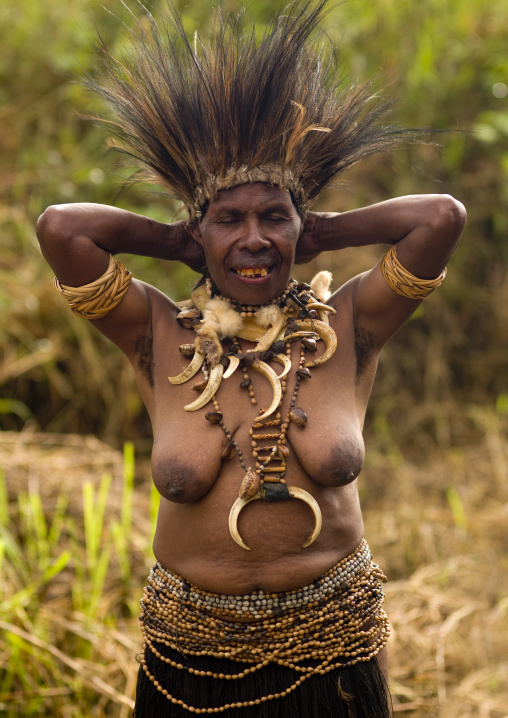 Portrait of a Chimbu tribe woman with a pig tusks necklace during a Sing-sing, Western Highlands Province, Mount Hagen, Papua New Guinea