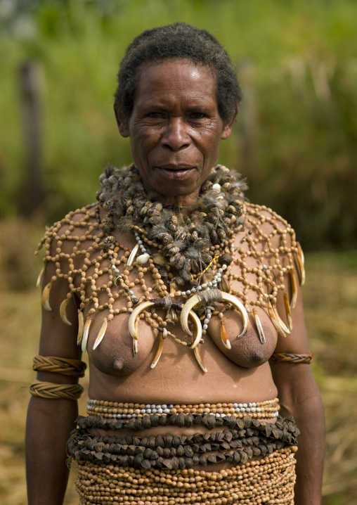 Portrait of a Chimbu tribe woman with a pig tusks necklace during a Sing-sing, Western Highlands Province, Mount Hagen, Papua New Guinea