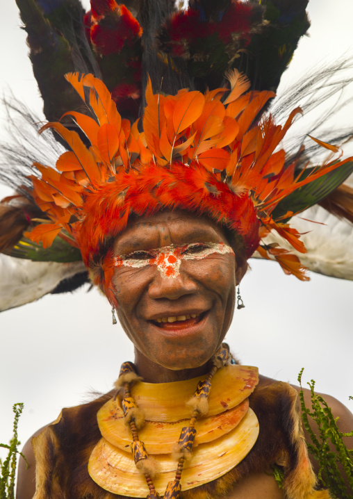 Portrait of a Chimbu tribe woman with headdress made of feathers during a Sing-sing, Western Highlands Province, Mount Hagen, Papua New Guinea