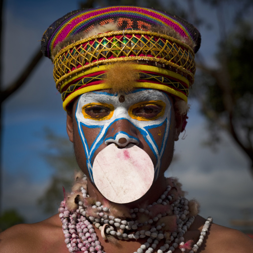 Highlander boy with traditional makeup during a sing-sing, Western Highlands Province, Mount Hagen, Papua New Guinea