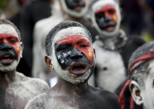 Children with a papuan flag makeup on the face, Western Highlands Province, Mount Hagen, Papua New Guinea