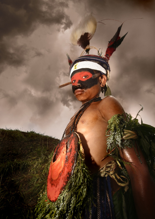 Highlander boy with traditional makeup during a sing-sing, Western Highlands Province, Mount Hagen, Papua New Guinea