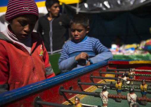 Young Peruvian Children Playing Baby Foot, Qoyllur Riti Festival, Ocongate Cuzco, Peru