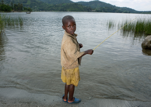 Rwandan boy fishing, Lake Kivu, Gisenye, Rwanda