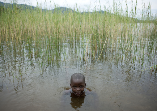 Rwandan boy having a bath, Lake Kivu, Gisenye, Rwanda