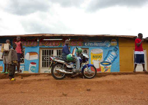 Rwandan people in front of a shop mural, Kigali Province, Kigali, Rwanda