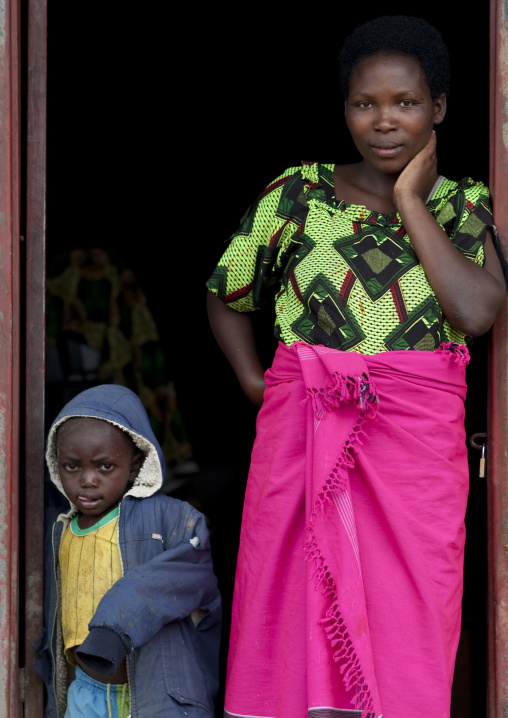 Rwandan mother and kid in front of their house, Northwest Province, Rehengeri, Rwanda