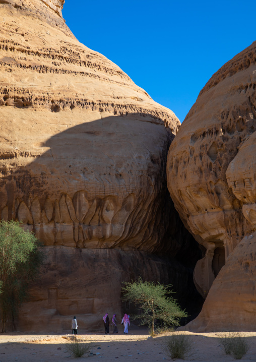 Tourists in al-Diwan in jebel Ithlib, Al Madinah Province, Alula, Saudi Arabia