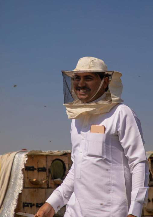 Saudi beekeeper working in the beehives, Jizan province, Addarb, Saudi Arabia